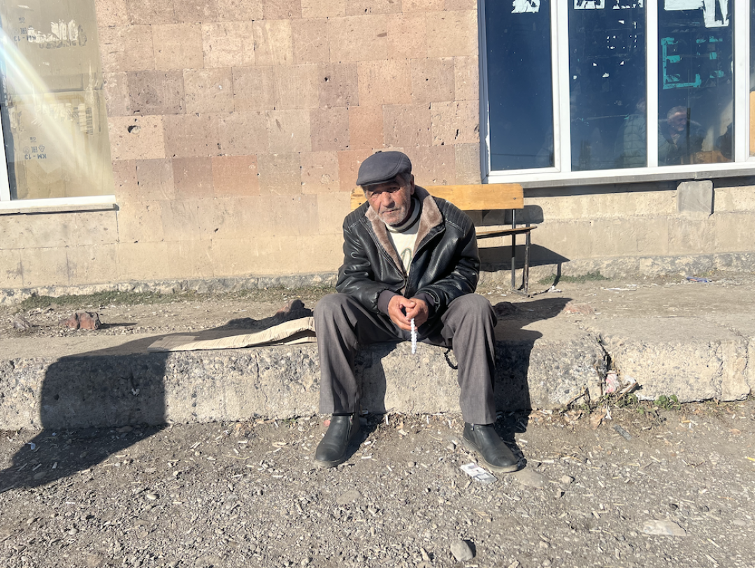 Gagik Petrosyan sitting in front of the Culture house in Khachaghbyur Gagik Petrosyan sitting in front of the Culture house in Khachaghbyur